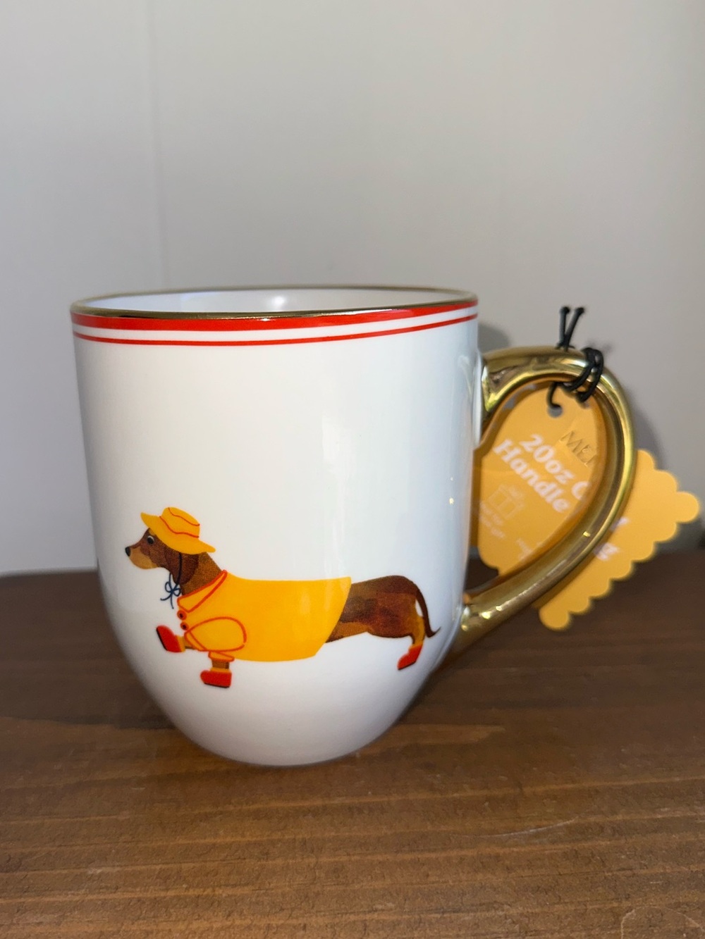 White Ceramic Dachshund Mug with Yellow Raincoat and Gold Handle